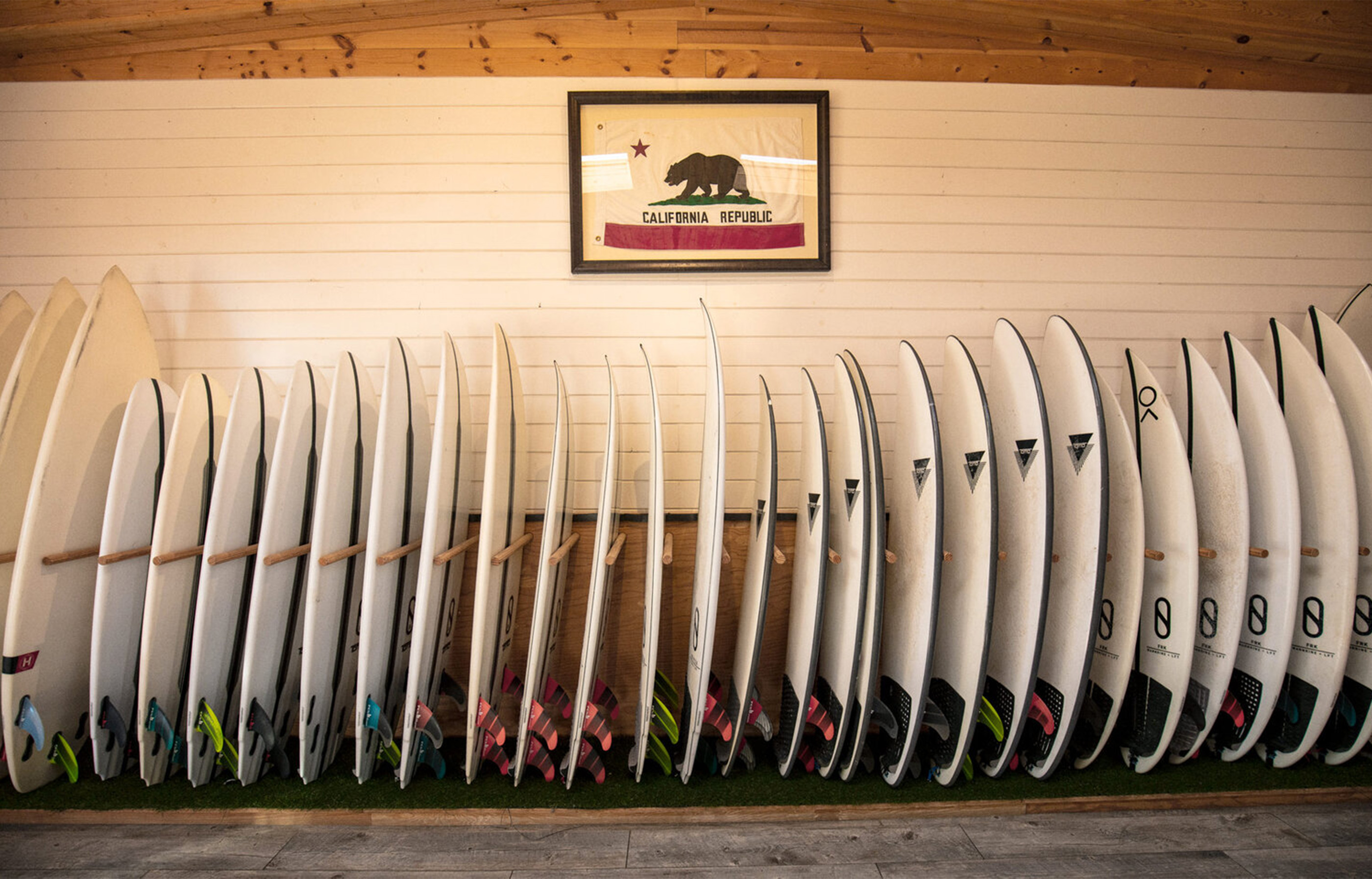Surfboard quiver in the board room at Surf Ranch